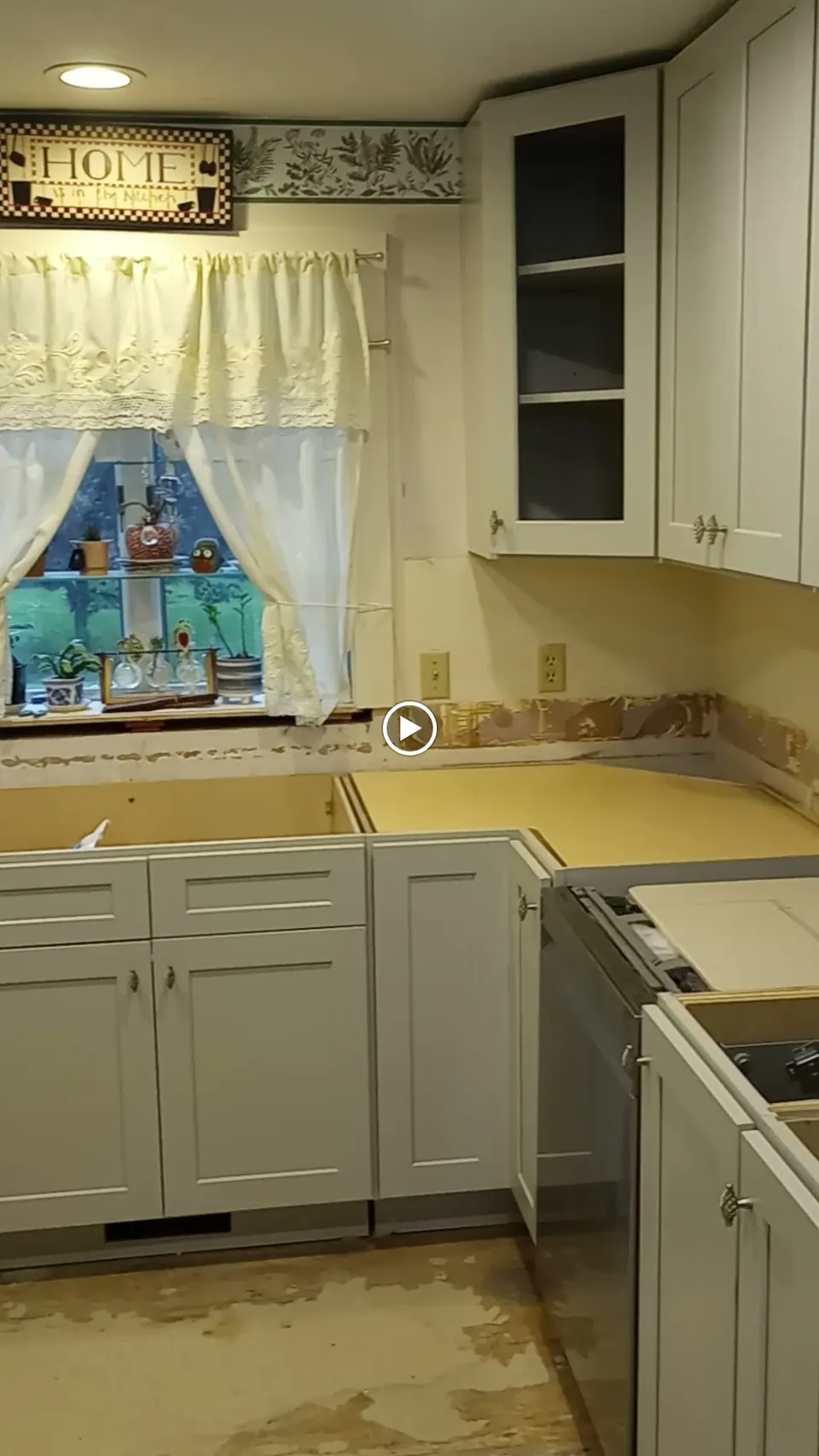 During the install: light gray cabinets in, counter not yet set.