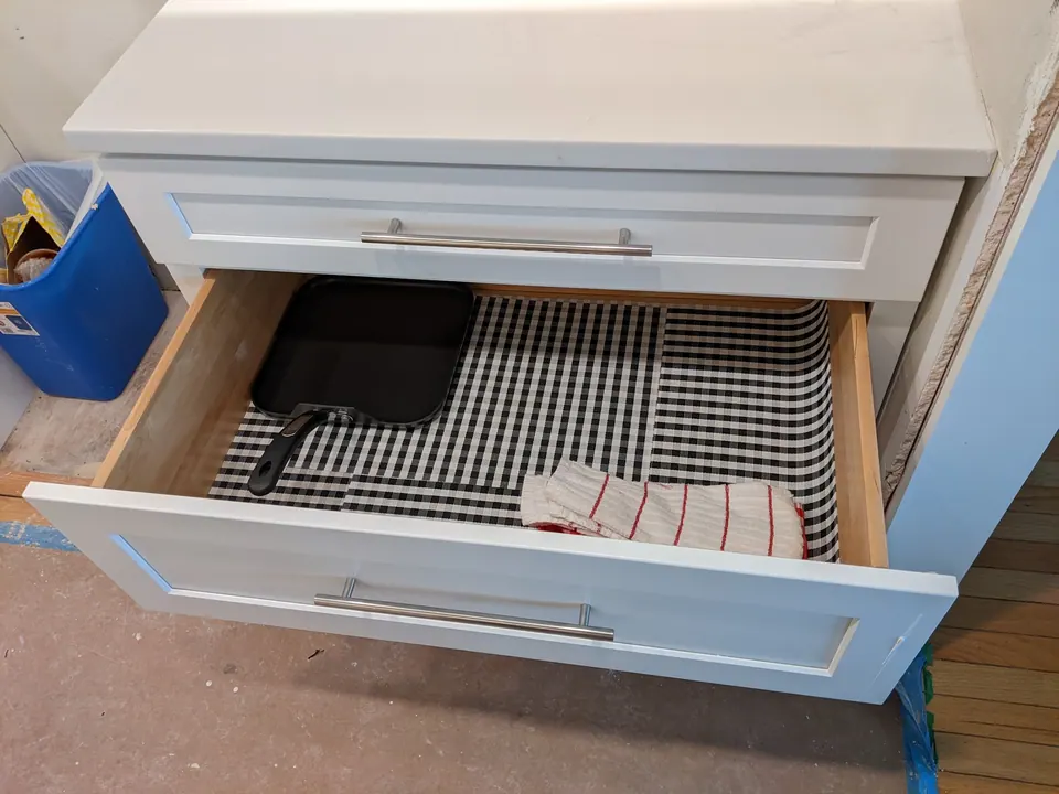 Deep drawer pulled out under the counter.