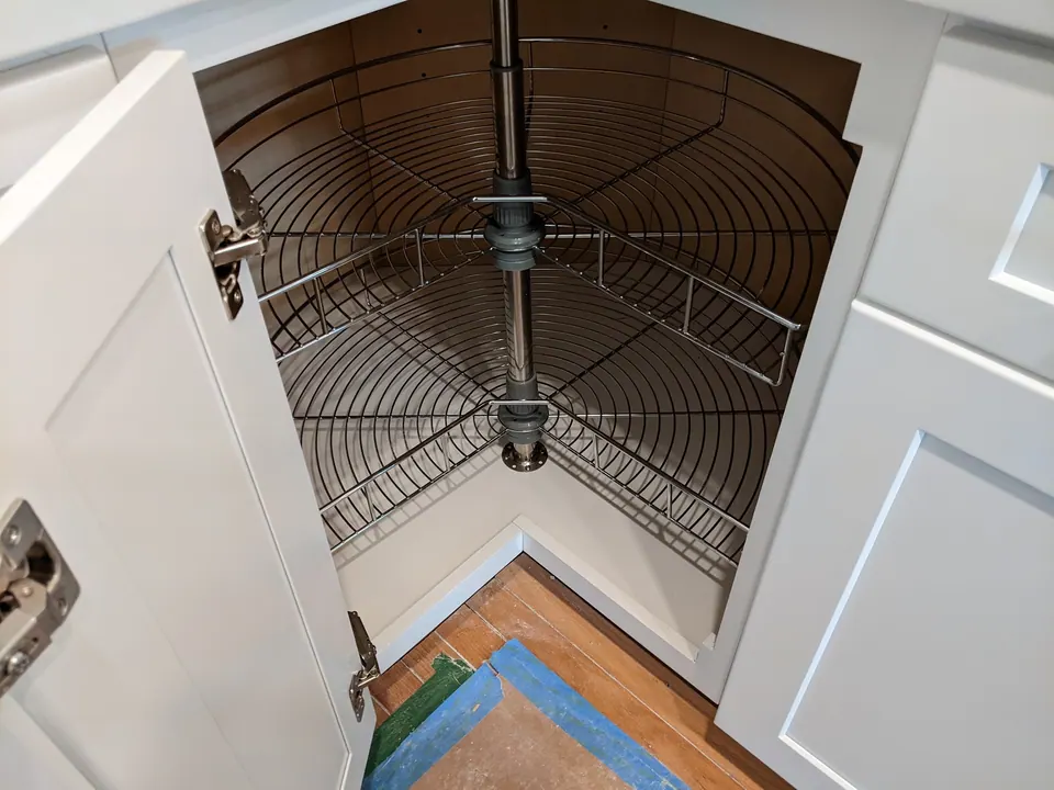 Corner cabinet with a lazy Susan.