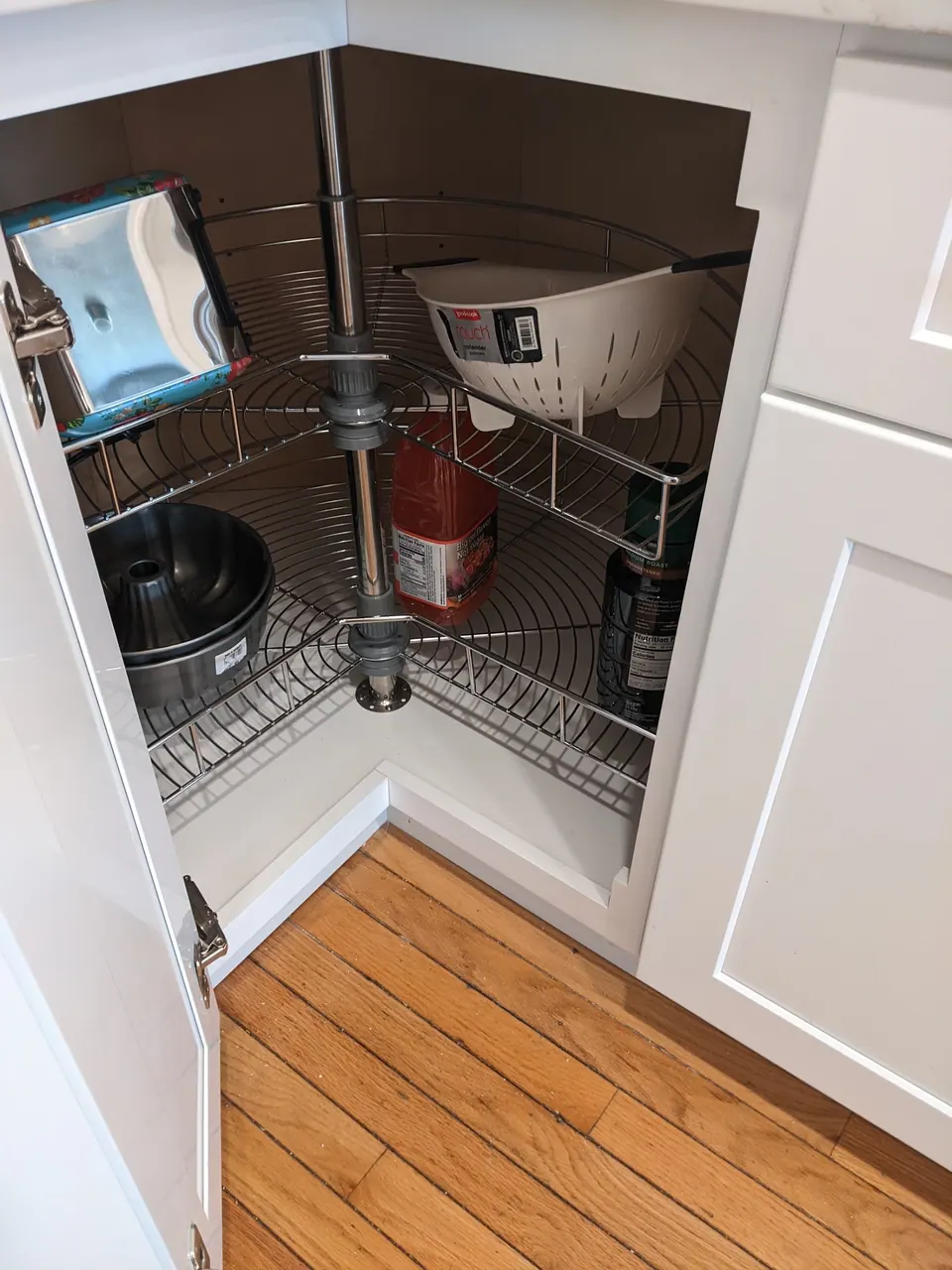Lazy Susan loaded with pots and pans.