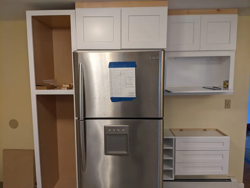 During the install: pantry box and refrigerator wall.