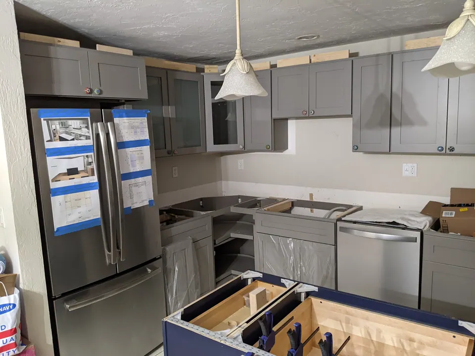 During the install: gray cabinets in, island boxes going in.