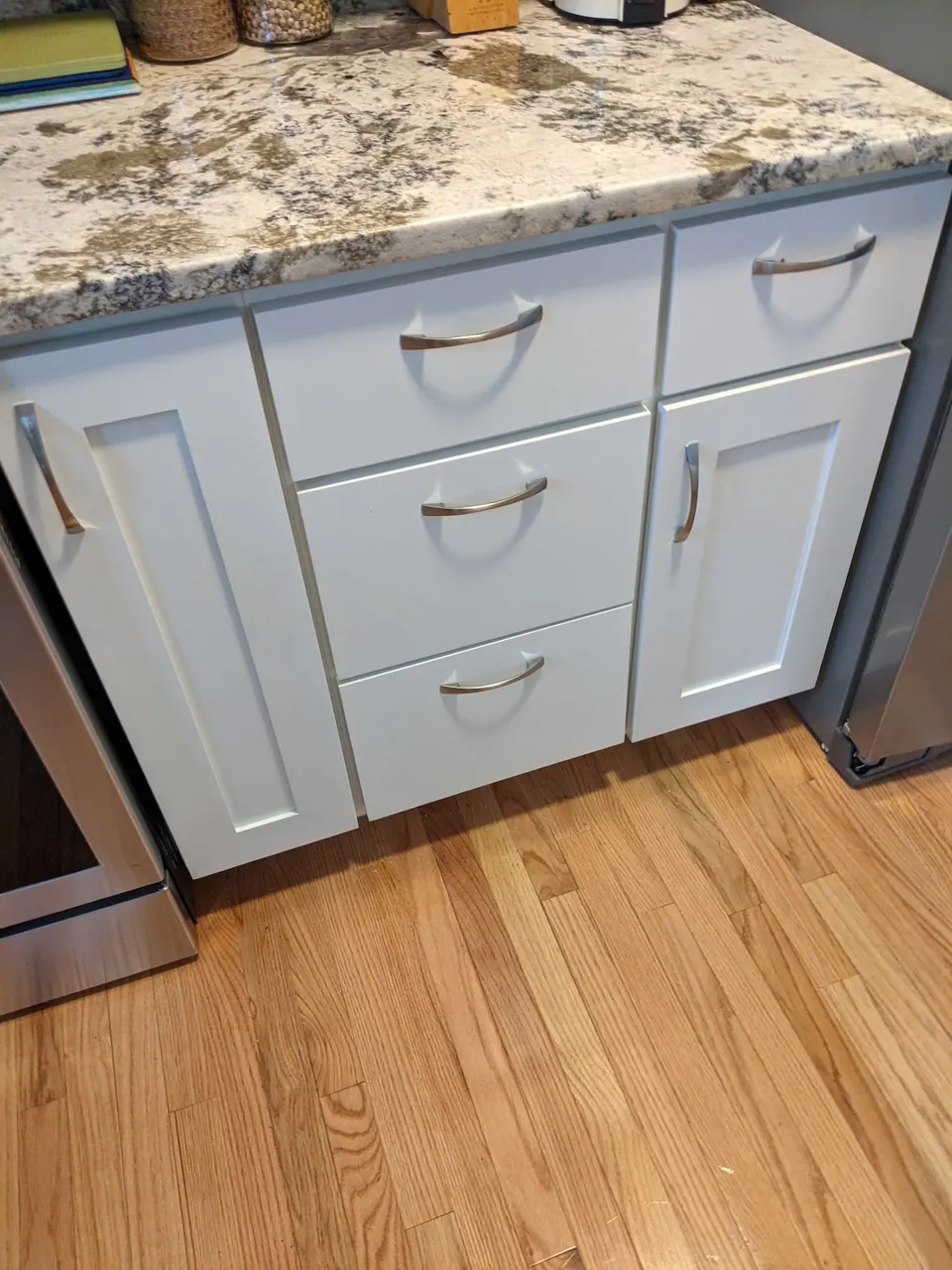 White drawer bases with a granite top.