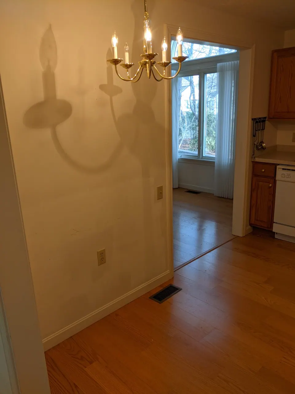 Before: the dining room behind the kitchen wall.