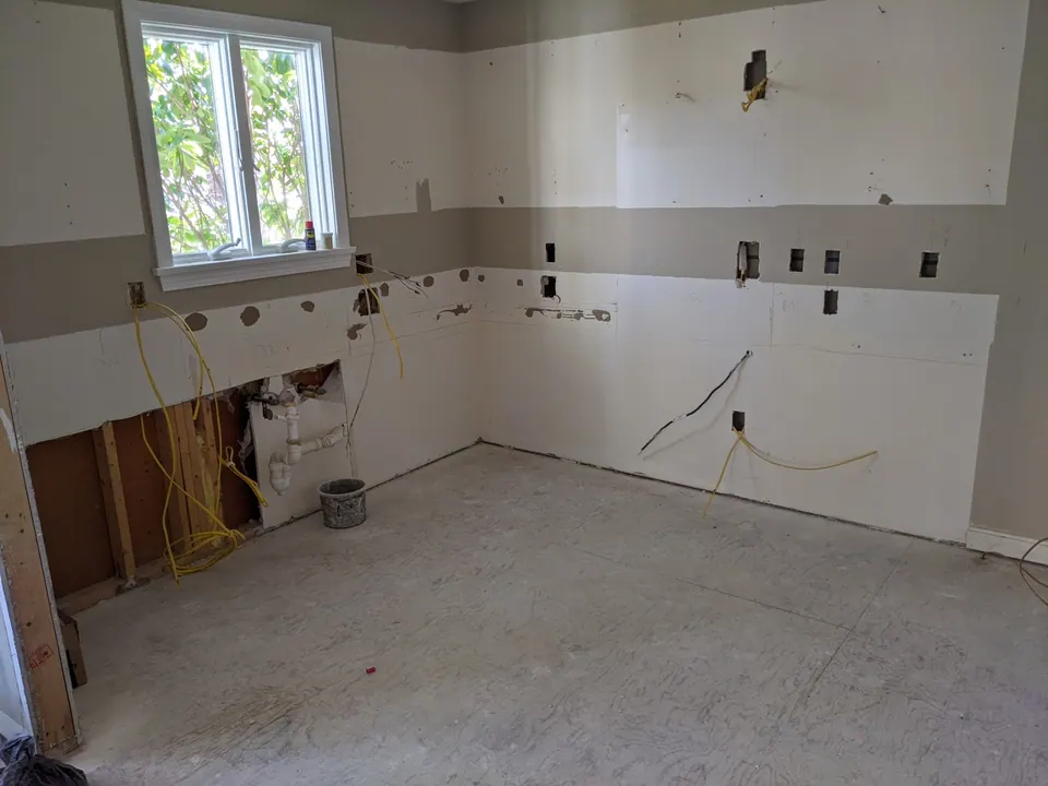 During the job: the kitchen stripped to the walls.