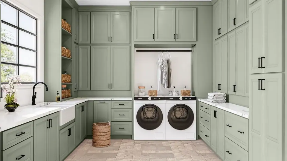 Rendering: sage green cabinets floor to ceiling around a washer and dryer, farmhouse sink and white counters.