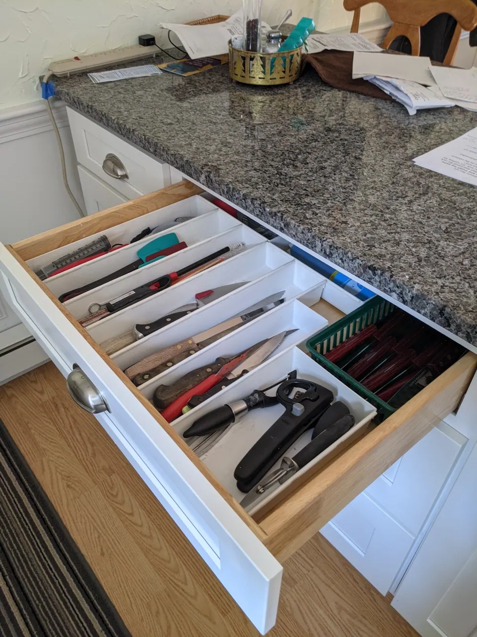 Cutlery drawer with a divider.