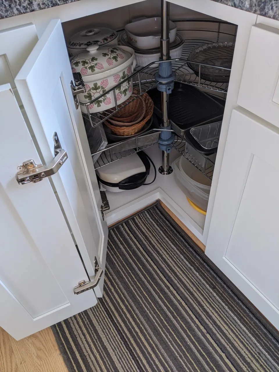 Corner cabinet with a lazy Susan.