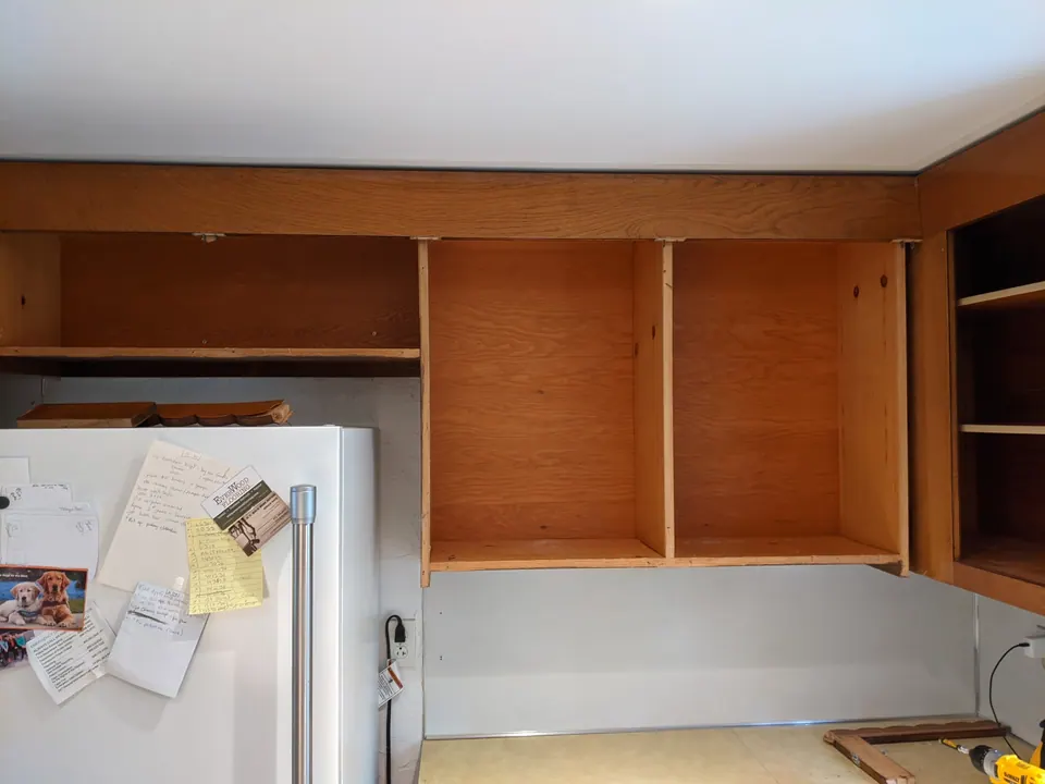 Before: oak wall cabinets.